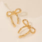 Gold bow earrings, simple and stylish glossy earrings